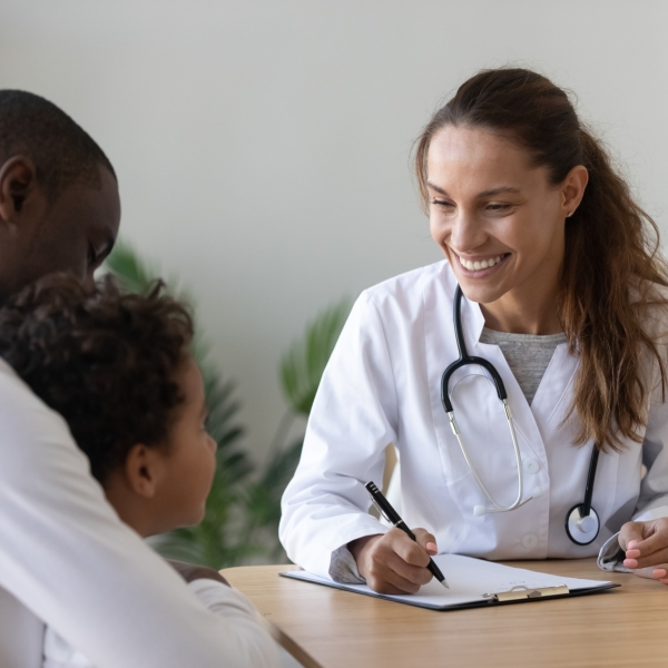 Doctor talking to patient and parent